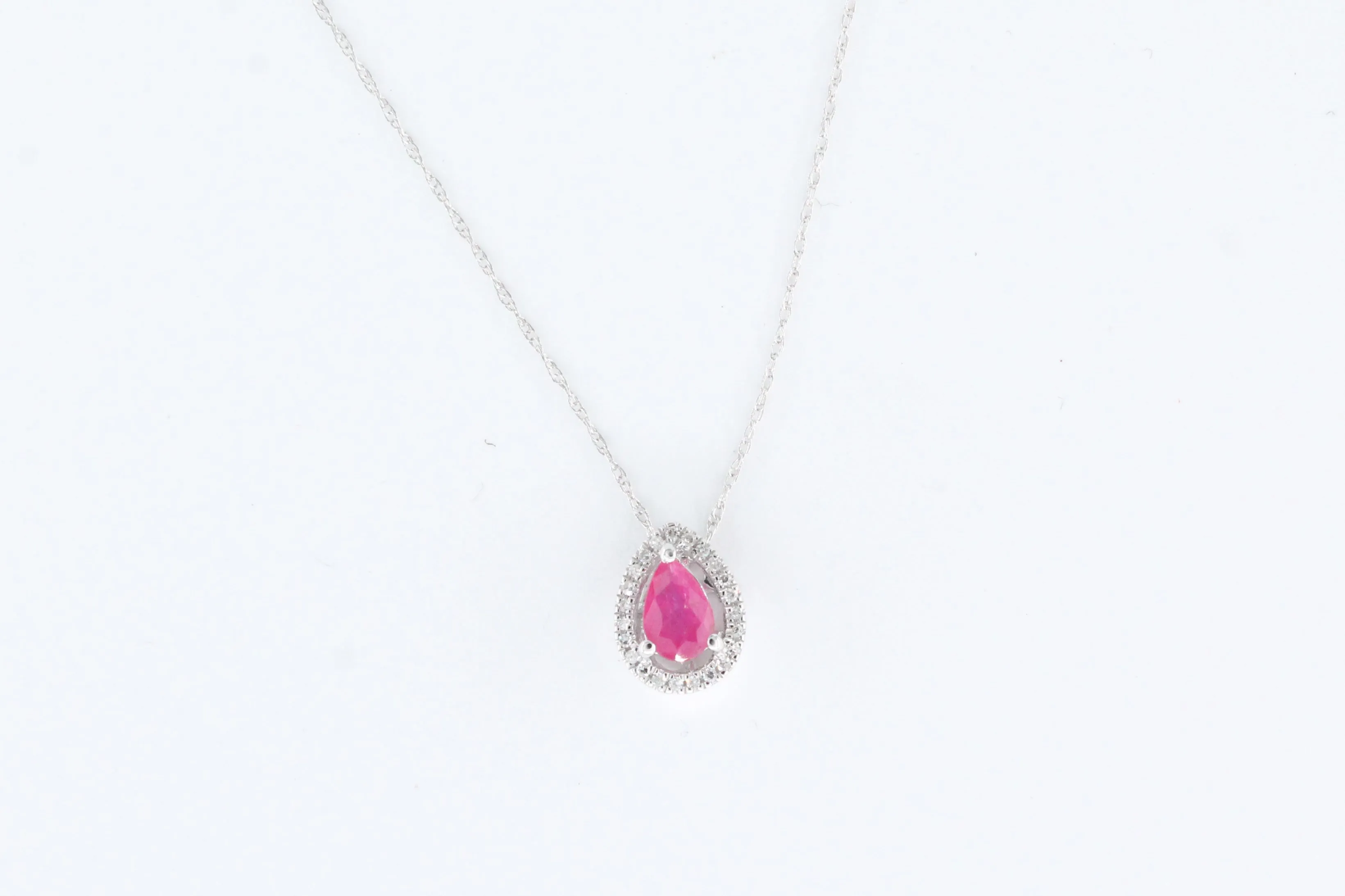 White Gold Ruby and Diamond Floating Halo Pendant with Chain